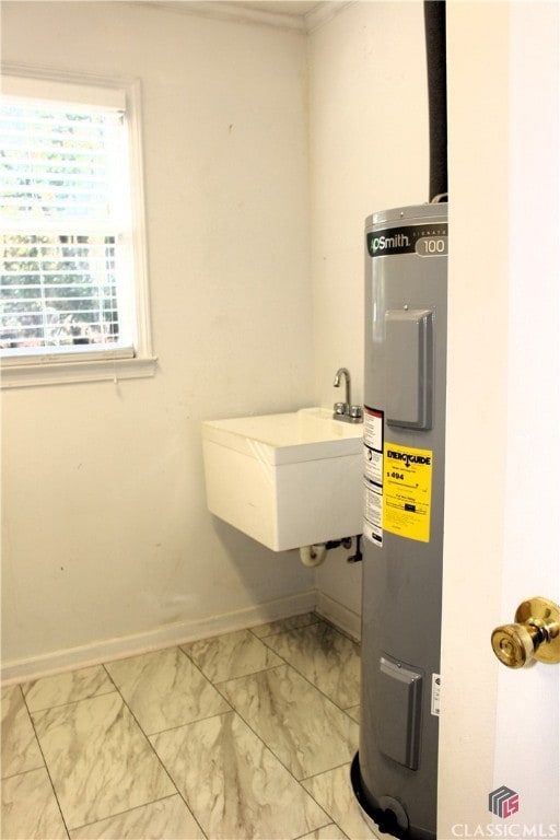 utilities with water heater and a sink