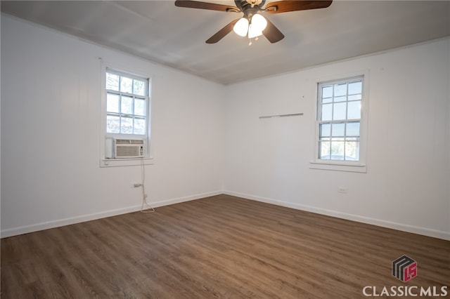 unfurnished room featuring ceiling fan, cooling unit, and dark wood-type flooring