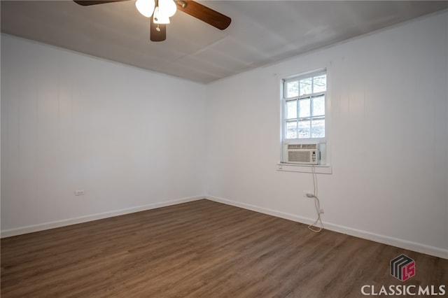 unfurnished room with ceiling fan, cooling unit, and dark wood-type flooring