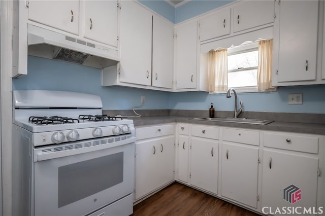 kitchen featuring white range with gas stovetop, dark hardwood / wood-style flooring, white cabinetry, and sink