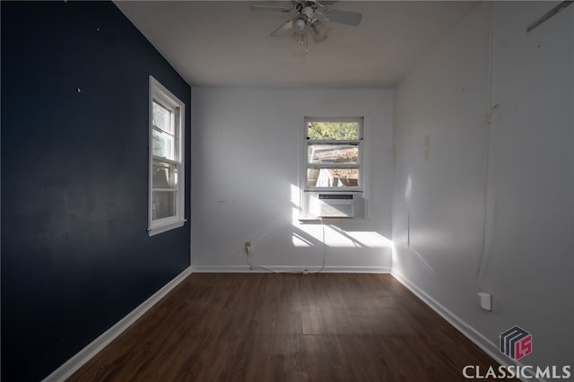 spare room featuring ceiling fan and dark hardwood / wood-style flooring