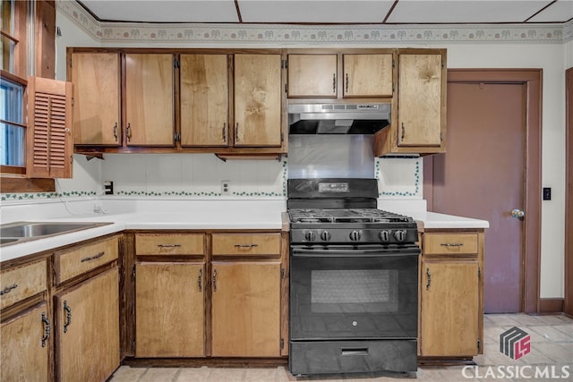 kitchen with decorative backsplash and black range with gas stovetop