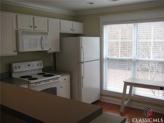 kitchen featuring plenty of natural light, white cabinets, white appliances, and ornamental molding