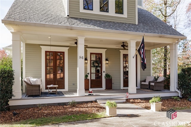 entrance to property featuring ceiling fan, french doors, and covered porch