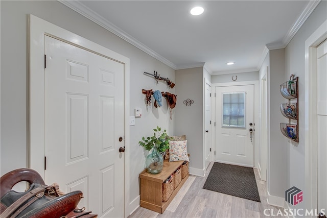 interior space with ornamental molding and light wood-type flooring