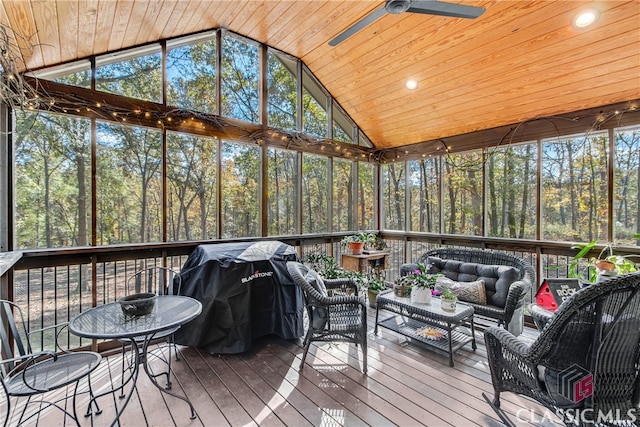 sunroom with ceiling fan, lofted ceiling, and wooden ceiling