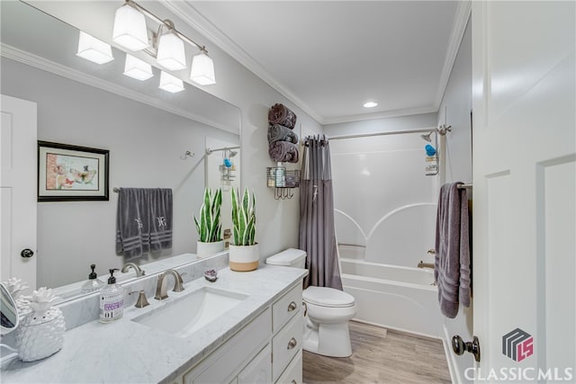 full bathroom featuring vanity, toilet, ornamental molding, wood-type flooring, and shower / tub combo