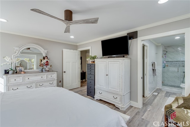 bedroom featuring ceiling fan, light wood-type flooring, ornamental molding, and connected bathroom