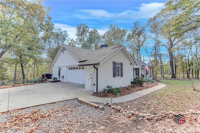 view of side of home featuring a garage