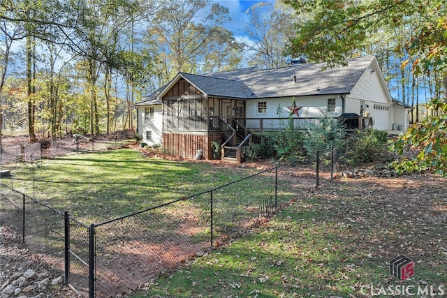 exterior space featuring a garage and a yard