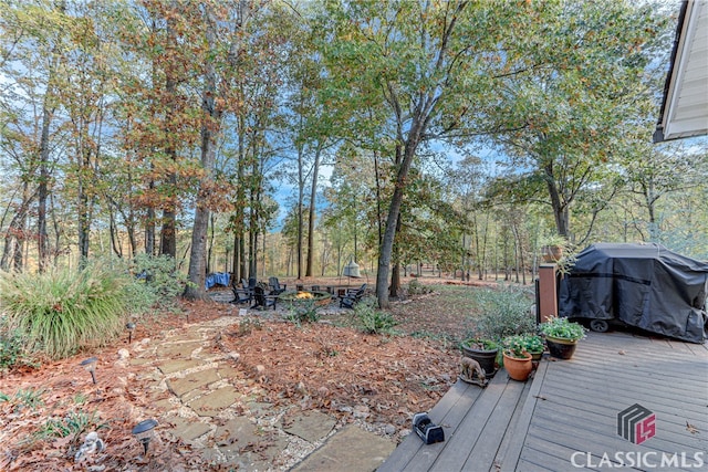 view of yard featuring a wooden deck