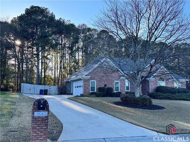 view of side of property with a garage and a lawn