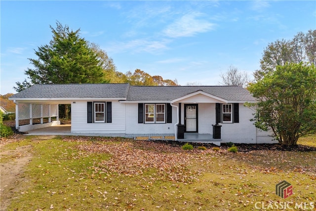 ranch-style house featuring a carport and a porch