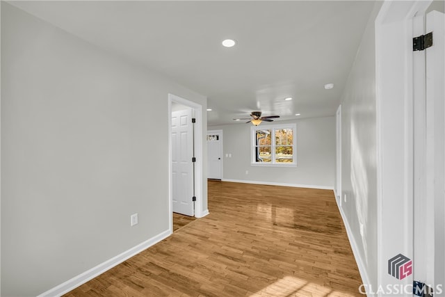 interior space with ceiling fan and hardwood / wood-style flooring