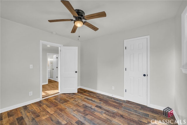 unfurnished bedroom featuring dark hardwood / wood-style flooring and ceiling fan