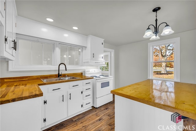 kitchen featuring butcher block counters, sink, white range with electric cooktop, decorative light fixtures, and white cabinets