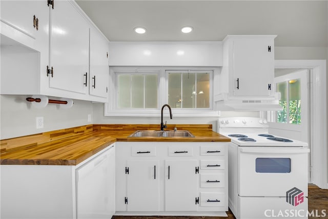 kitchen with dark hardwood / wood-style flooring, white appliances, extractor fan, sink, and white cabinetry