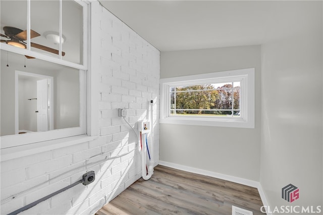 bathroom with hardwood / wood-style flooring and lofted ceiling