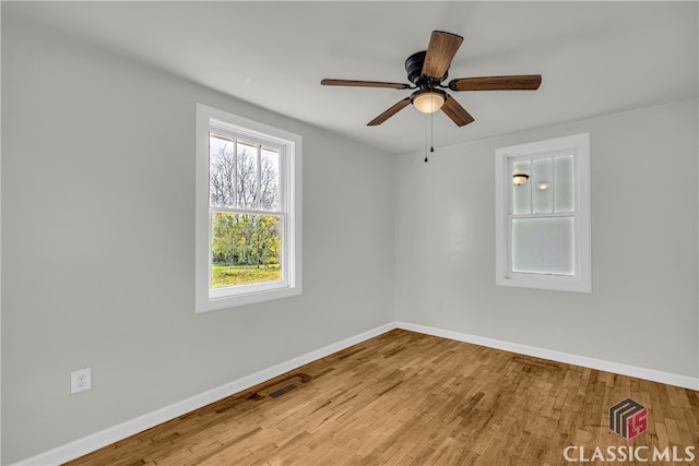 spare room featuring ceiling fan and light hardwood / wood-style floors