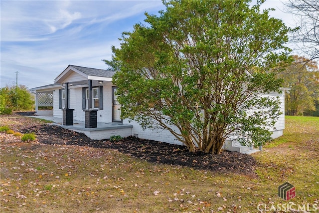 view of property exterior with covered porch