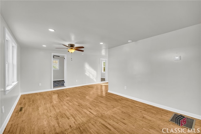 empty room featuring ceiling fan and light wood-type flooring