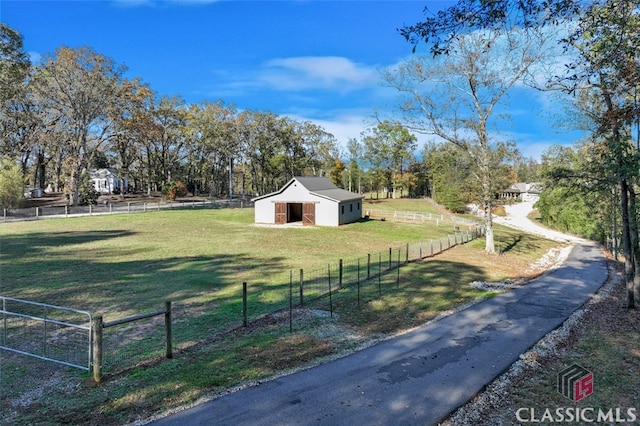 exterior space with a rural view and an outbuilding