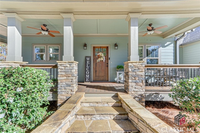 entrance to property featuring ceiling fan and a porch