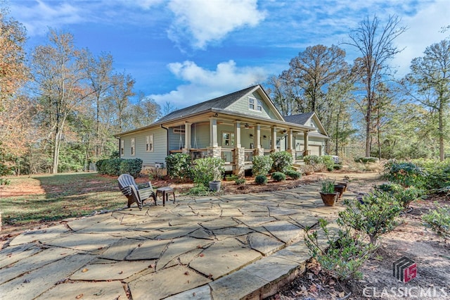 rear view of house with a porch