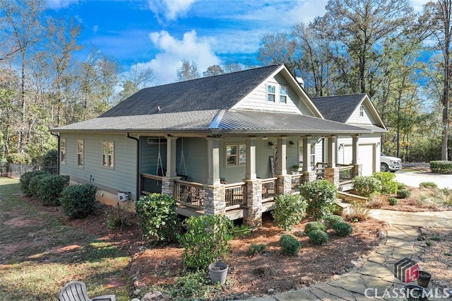 view of front of property with a porch and a garage