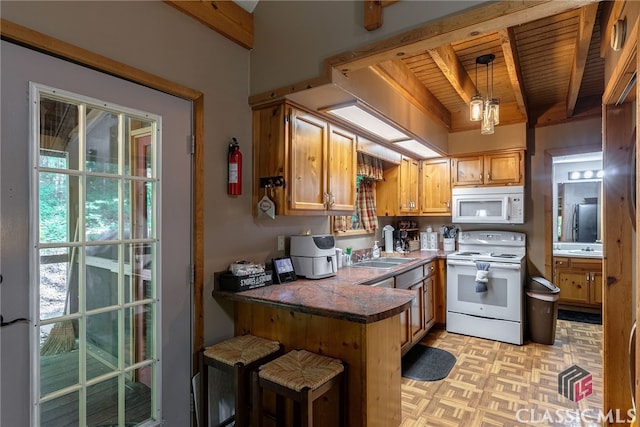 kitchen with hanging light fixtures, beamed ceiling, kitchen peninsula, white appliances, and wood ceiling