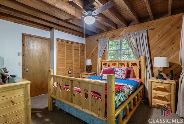 carpeted bedroom featuring beam ceiling, ceiling fan, wood walls, and wood ceiling