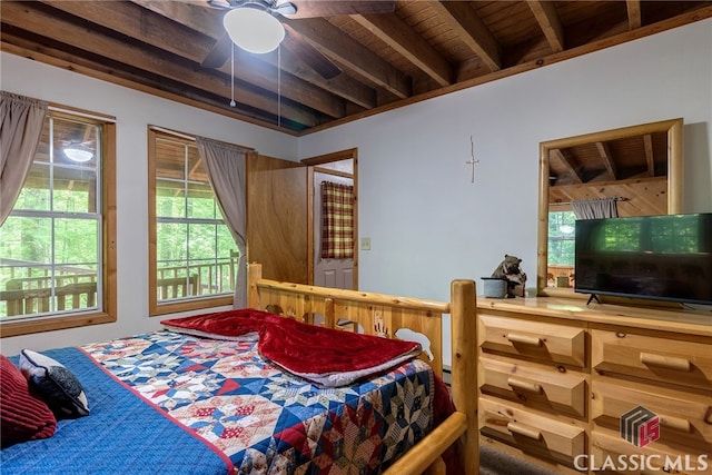 bedroom with multiple windows, ceiling fan, beamed ceiling, and wood ceiling