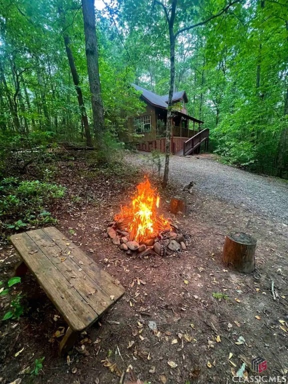 view of yard with a fire pit