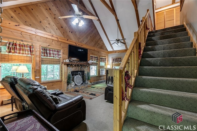 living room with high vaulted ceiling, ceiling fan, wooden walls, and a baseboard radiator