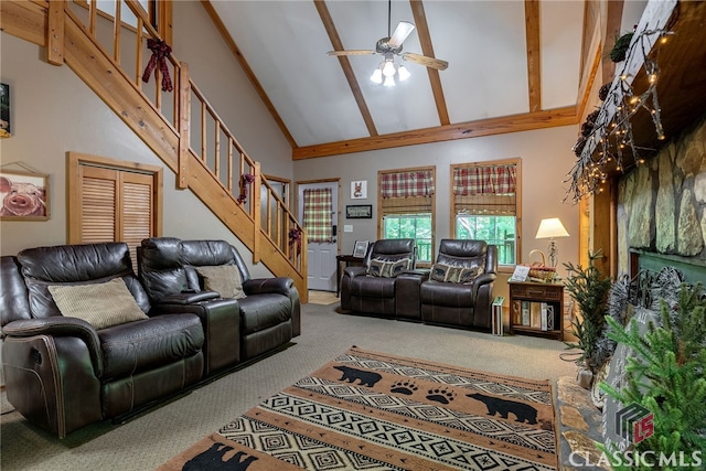 carpeted living room featuring beam ceiling, ceiling fan, and high vaulted ceiling