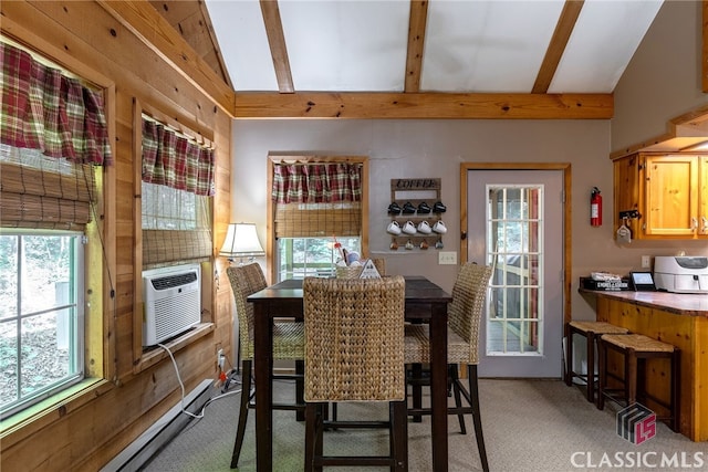 dining space with light carpet, lofted ceiling with beams, a wealth of natural light, and cooling unit