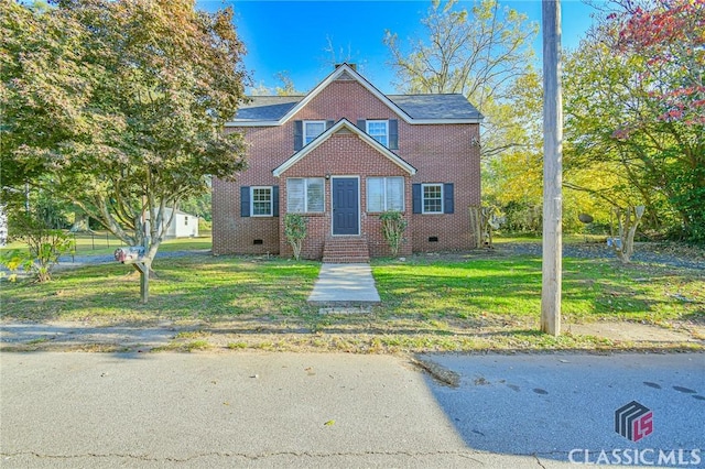 view of front of home with a front yard