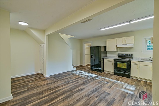 kitchen featuring white cabinets, sink, dark wood-type flooring, and black appliances