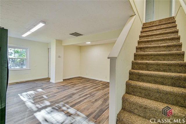 basement featuring hardwood / wood-style flooring