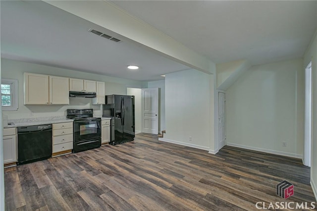 kitchen with beam ceiling, white cabinetry, black appliances, and dark hardwood / wood-style floors