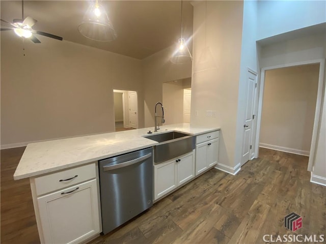 kitchen featuring kitchen peninsula, dark hardwood / wood-style flooring, sink, dishwasher, and white cabinetry