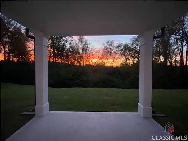 patio terrace at dusk with a yard