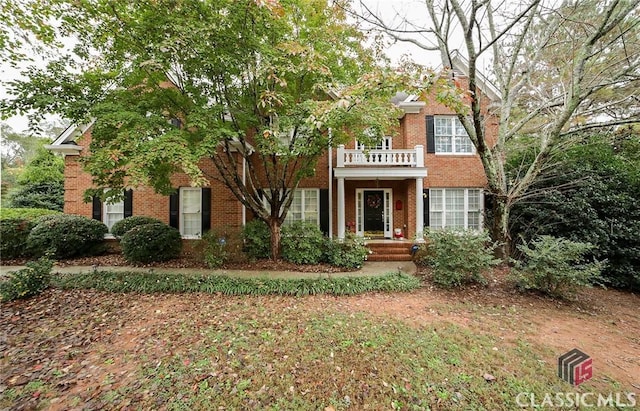 view of front of property with a balcony