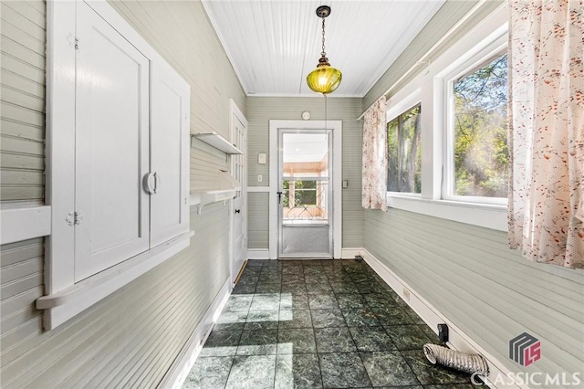 doorway featuring wood walls