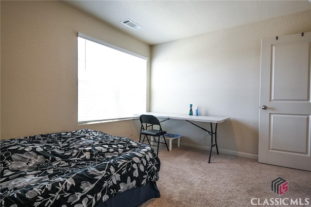 bedroom featuring carpet