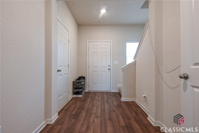 corridor with dark wood-type flooring