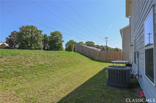 view of yard featuring central air condition unit