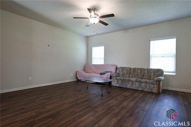 sitting room featuring dark hardwood / wood-style floors and ceiling fan