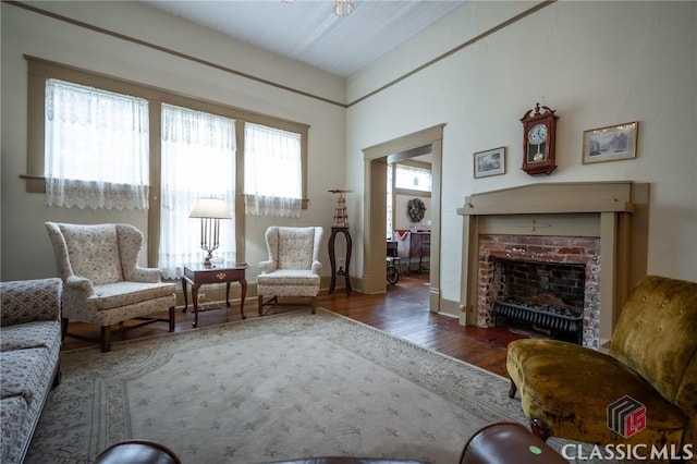 sitting room featuring dark hardwood / wood-style flooring