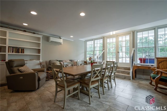 dining space featuring a wall unit AC